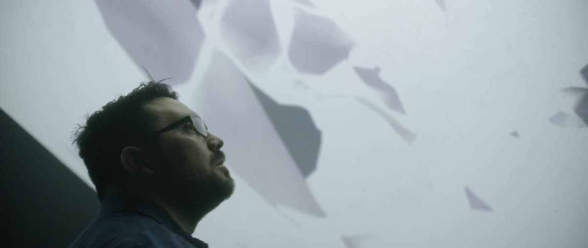 A man watching a multimedia display