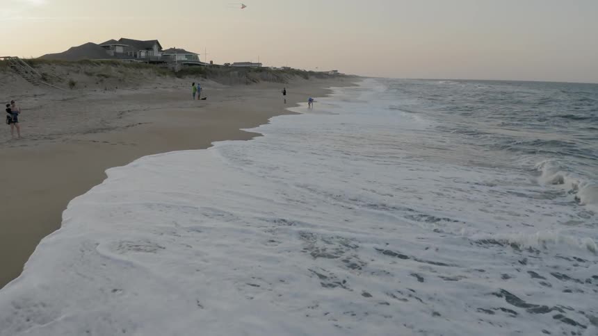People hang out on the beach