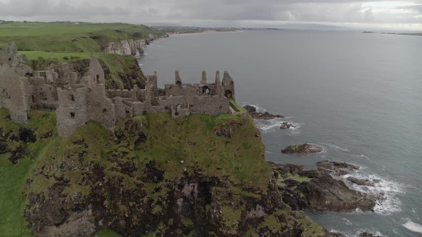 The ruins of a castle on a cliff bordering the ocean