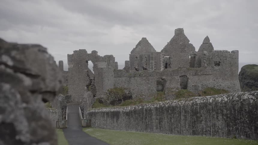 A vintage castle that is at the end of a sidewalk