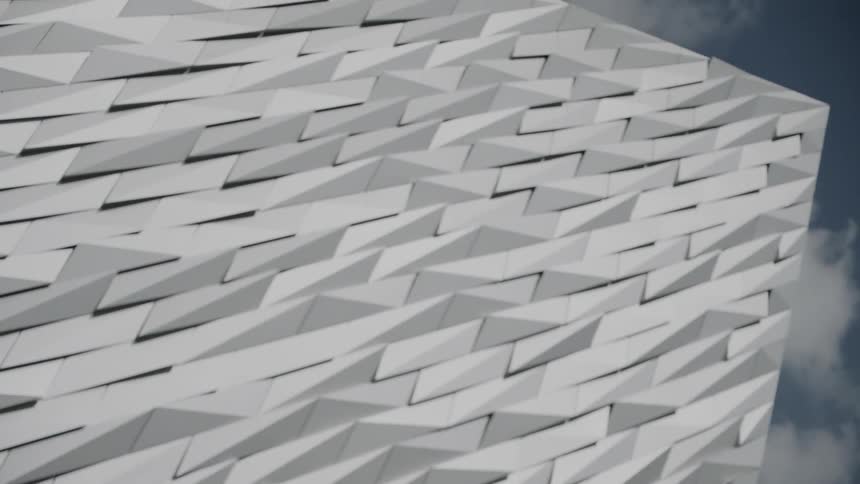 Composite geometric shape under cloudy blue sky
