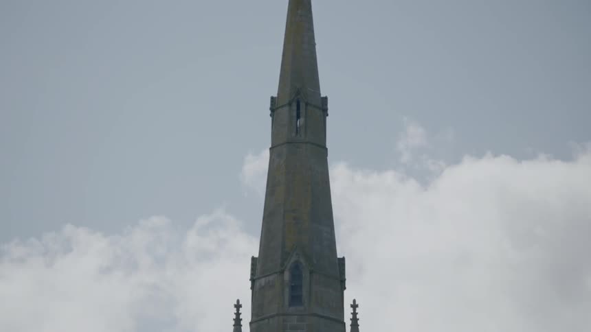 A steeple rises into the sky