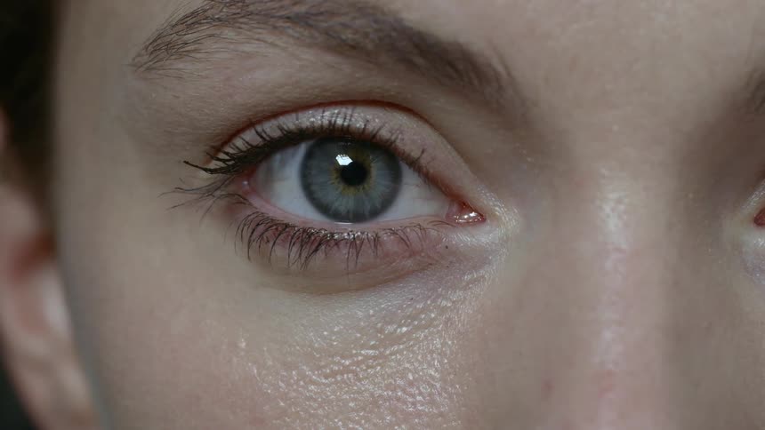 A woman staring and blinking