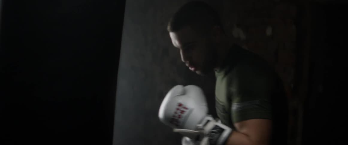 A man is boxing indoors