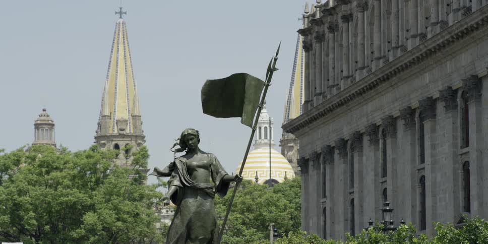 A statue sits outside a building