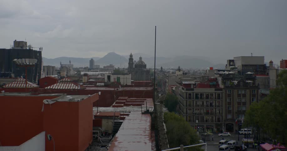 Rain falls on a large city