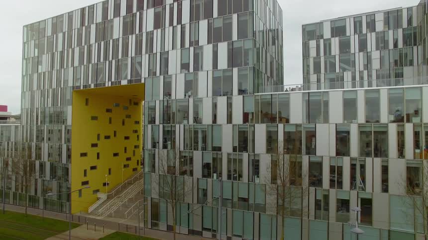 Reflections shine off an architectural building