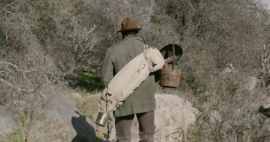 A man hikes through nature