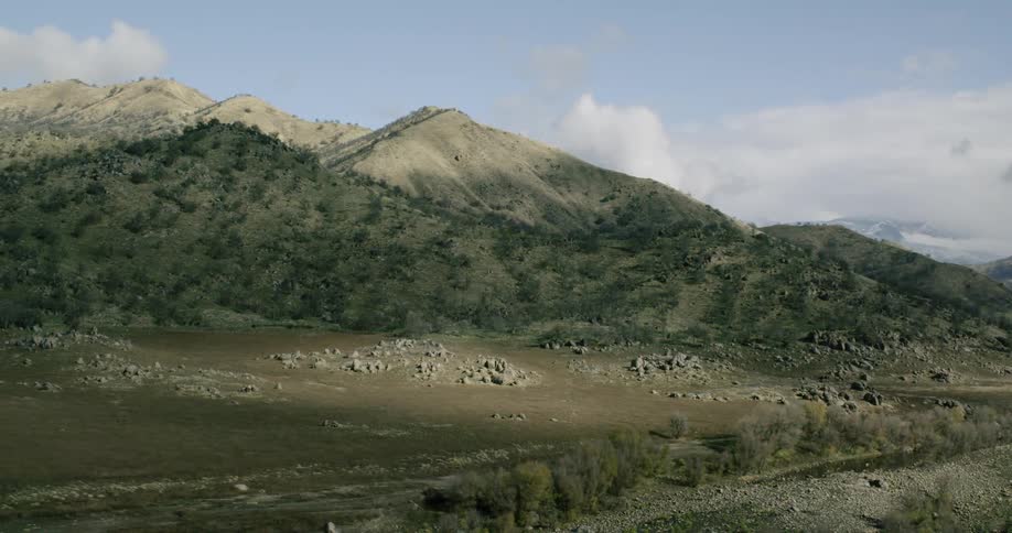 The mountains are covered with green in the distance