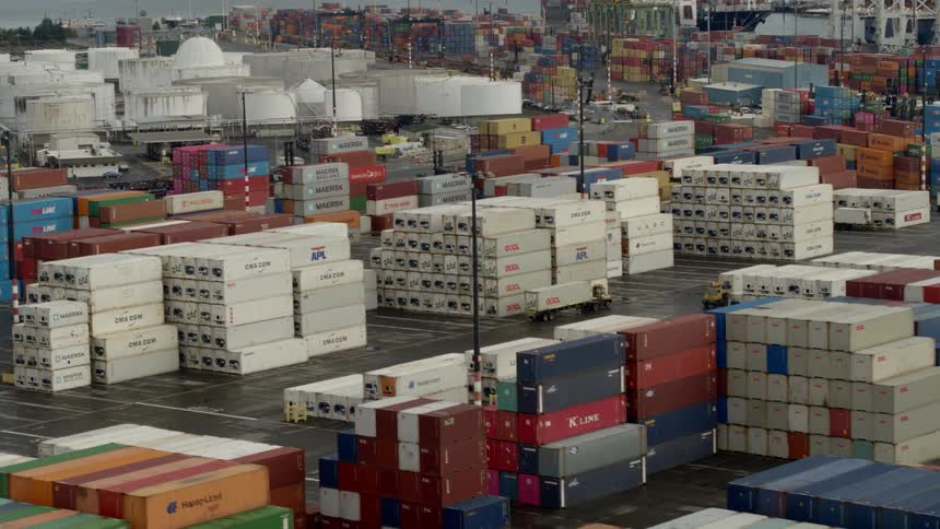 An aerial view of a shipping yard full of shipping containers