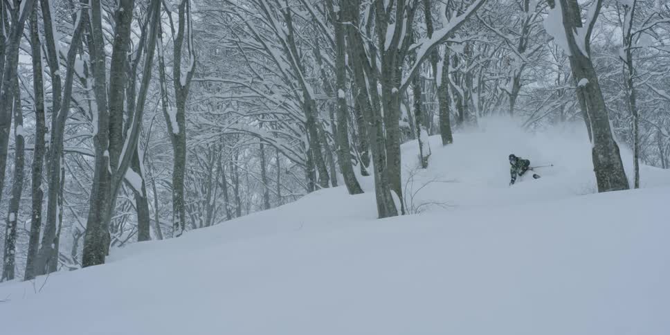 A person skiing down a slope