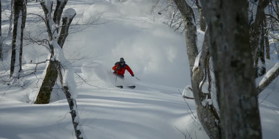 A man skiing down a slope
