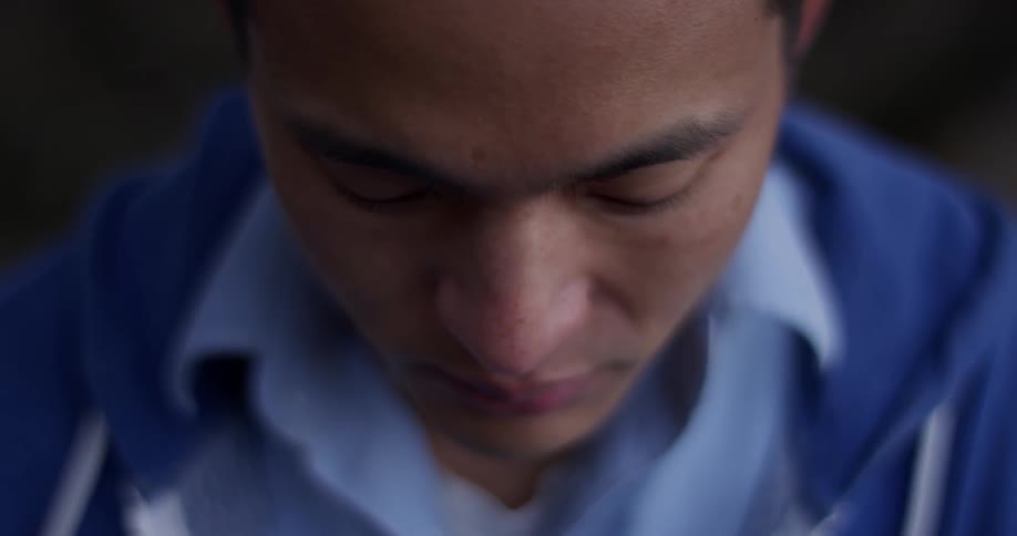A man looking down thinking
