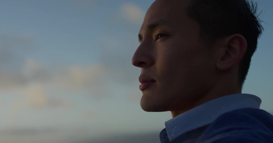 A young man looks ahead