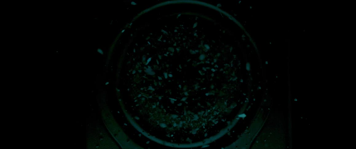 Broken glass being thrown around by a speaker