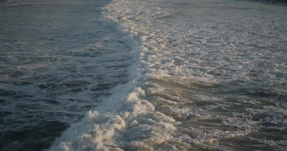 Waves roll across the ocean