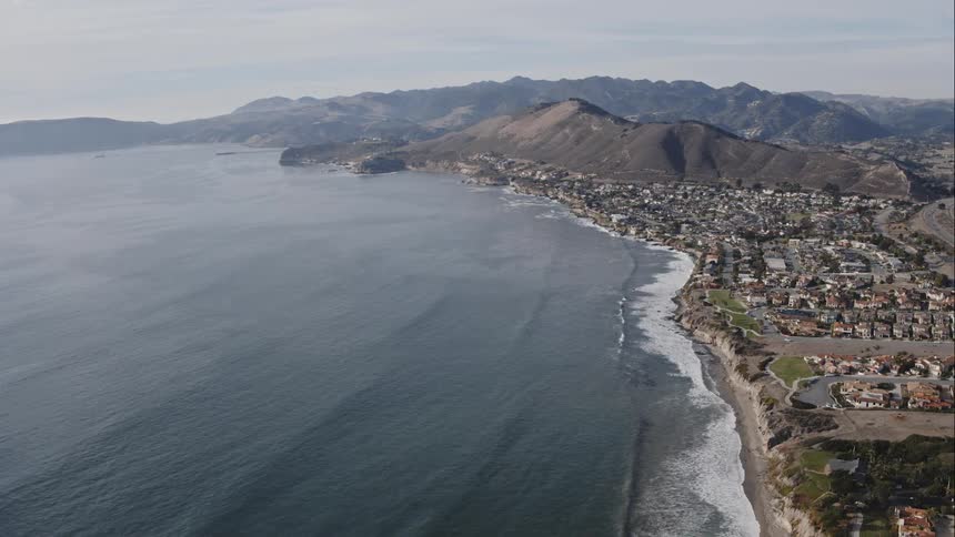Aerial view of the coastline near a neighborhood on and island