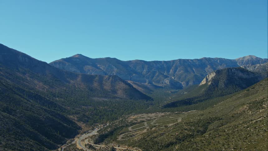 A quiet valley sits beneath a mountain range