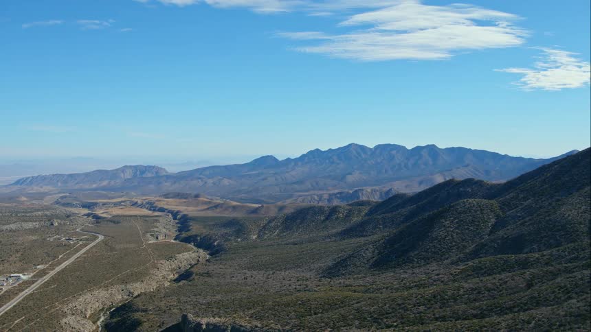 View of hills and the mountains in the background