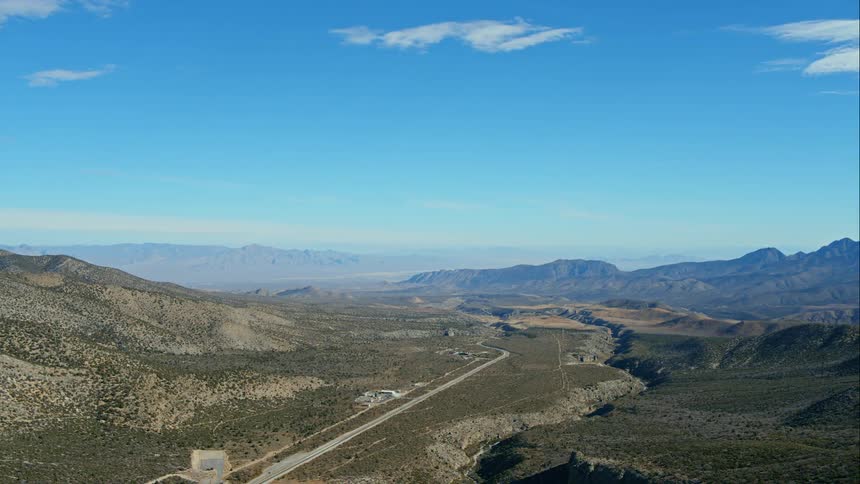 View across a hill towards the mountains