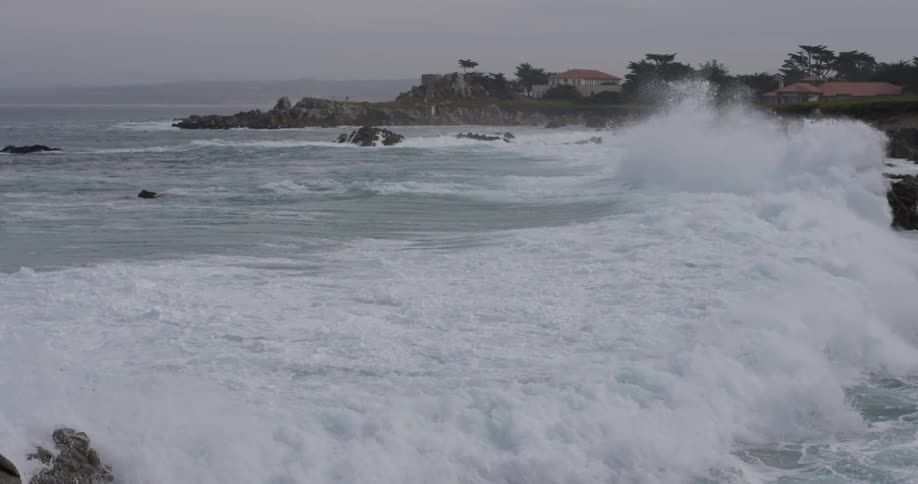 A huge wave crashes into the shore