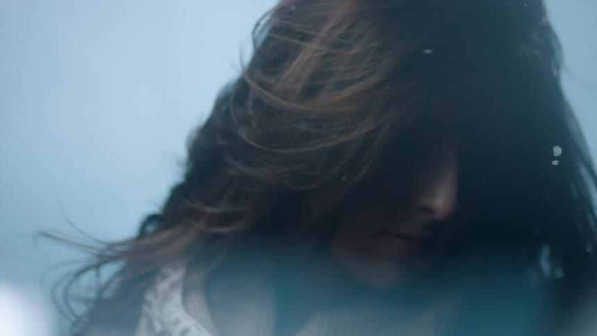 A person's hair blowing in the wind