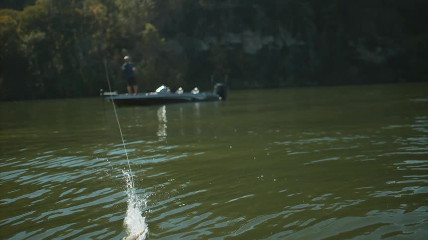 A person fishing on a raft