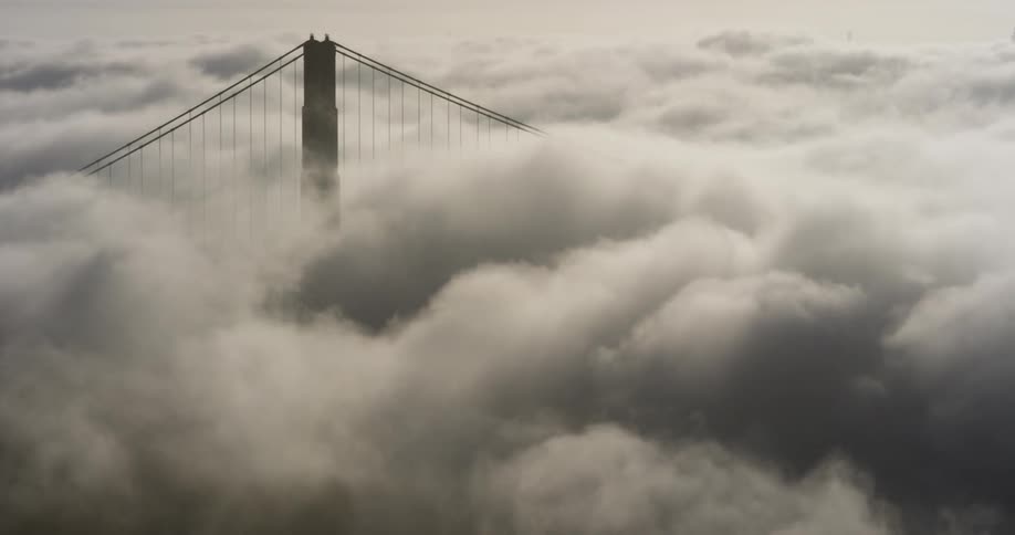 Clouds covering a bridge