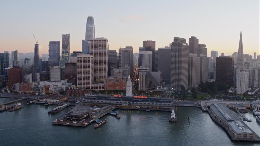San francisco skyline from harbor at sunset