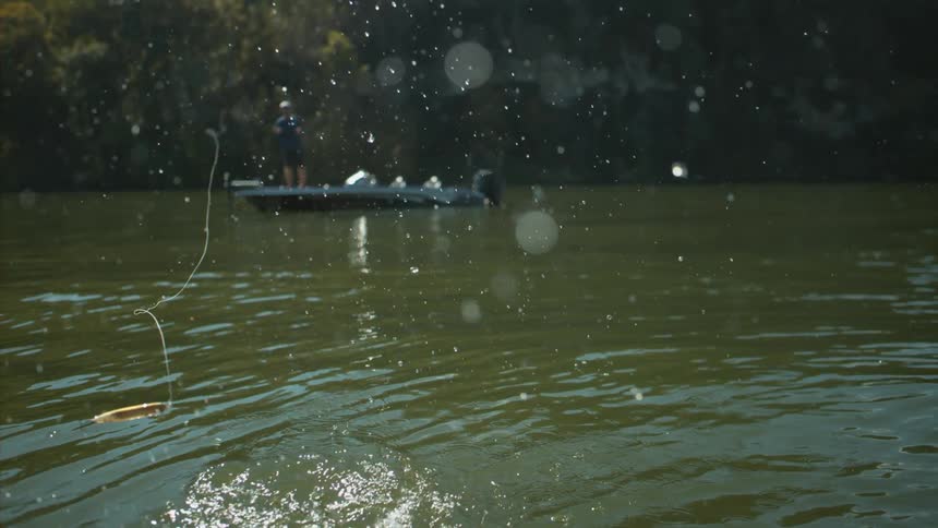 A man is fishing in a lake