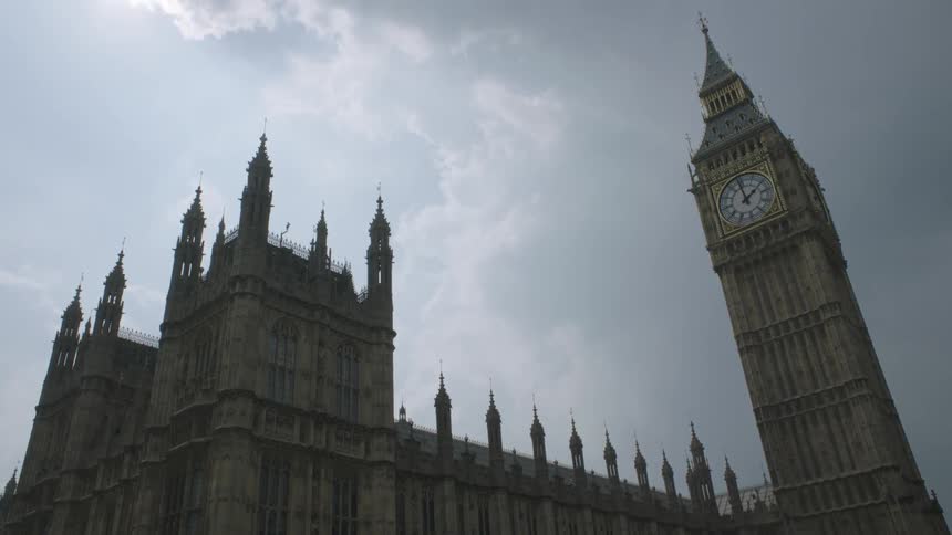 A clock tower on a mostly cloudy day