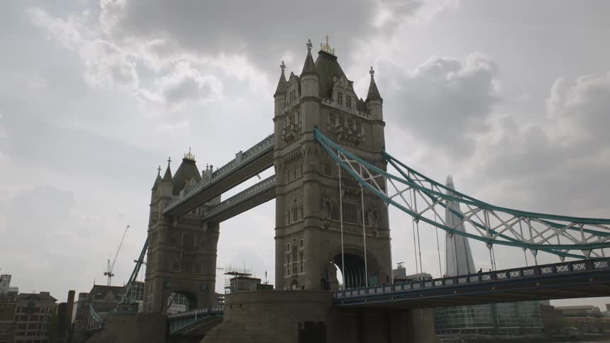 A city bridge towers overhead