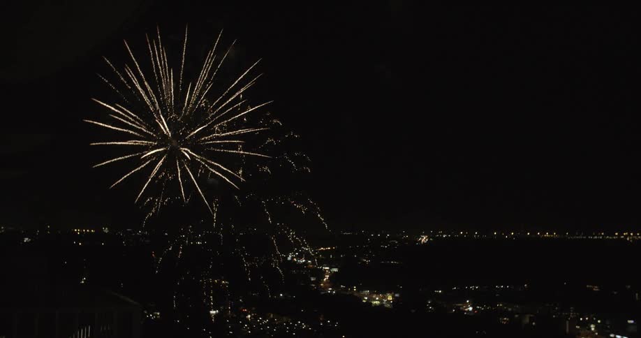 Fireworks being seen from a high balcony