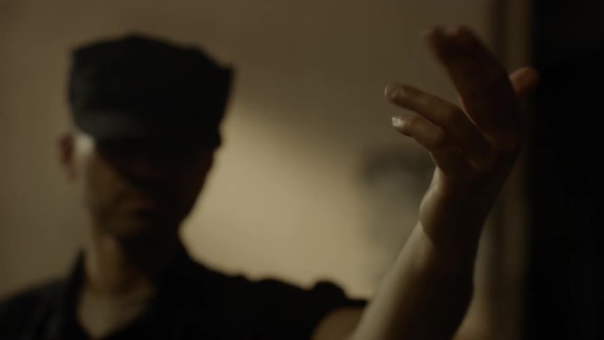 A man in uniform motions