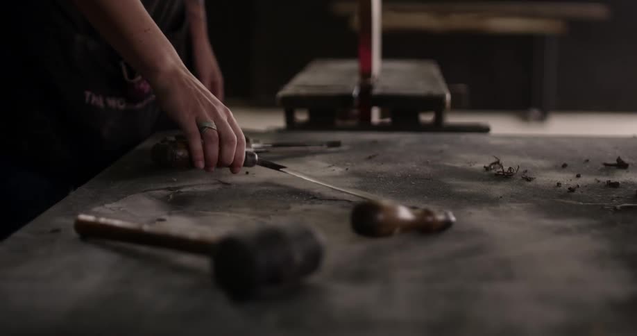 Craftsman using hand tools on workshop