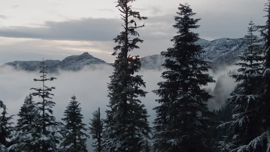 Clouds floating over the snow covered mountain