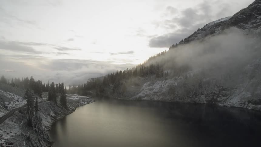 A lake sits in a mountain valley