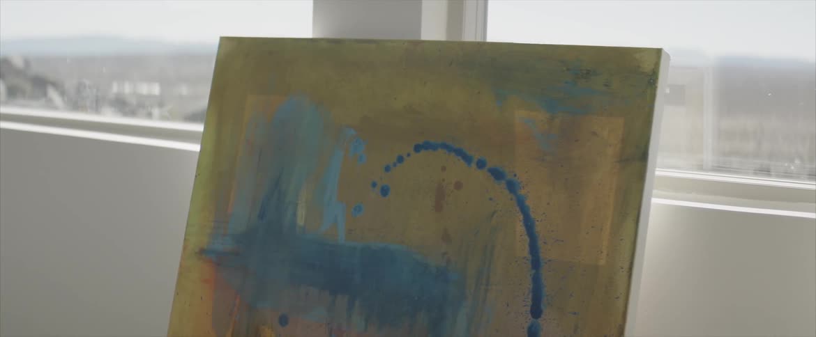 Exhibition of the a painting in front of the window in a room during daylight