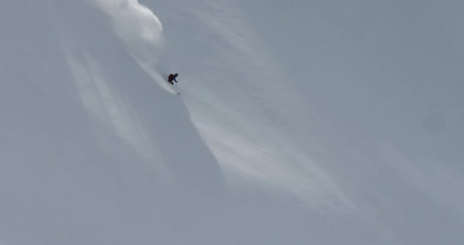 Skier goes down a steep mountain