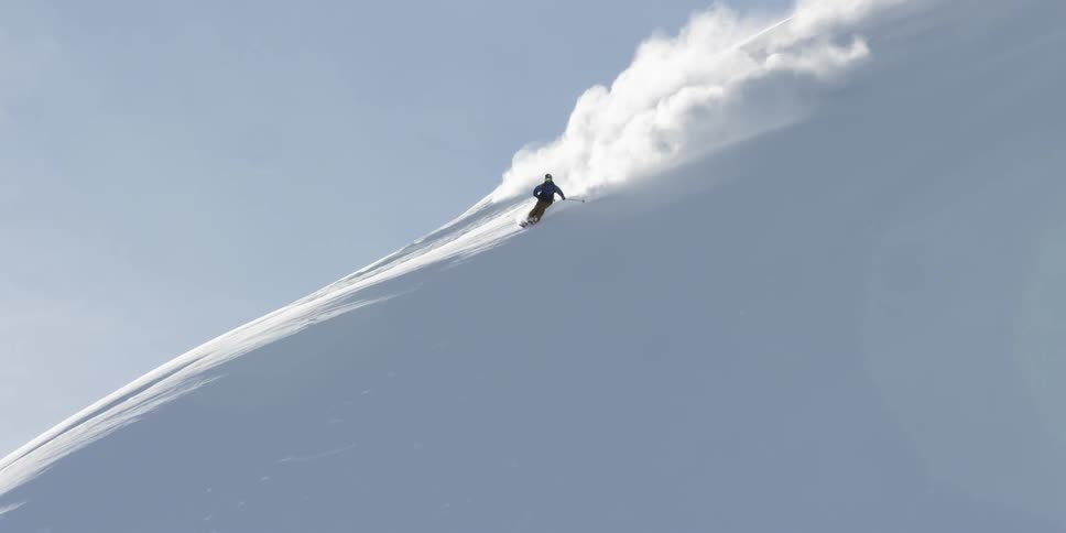People are skiing outdoors on a mountain