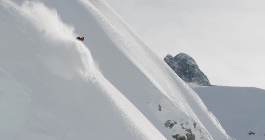 A person skiing down a very steep mountain