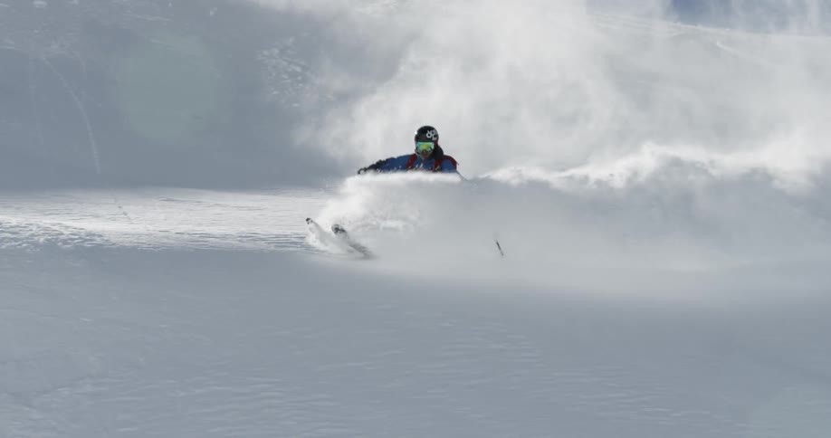 A person skiing down a hill