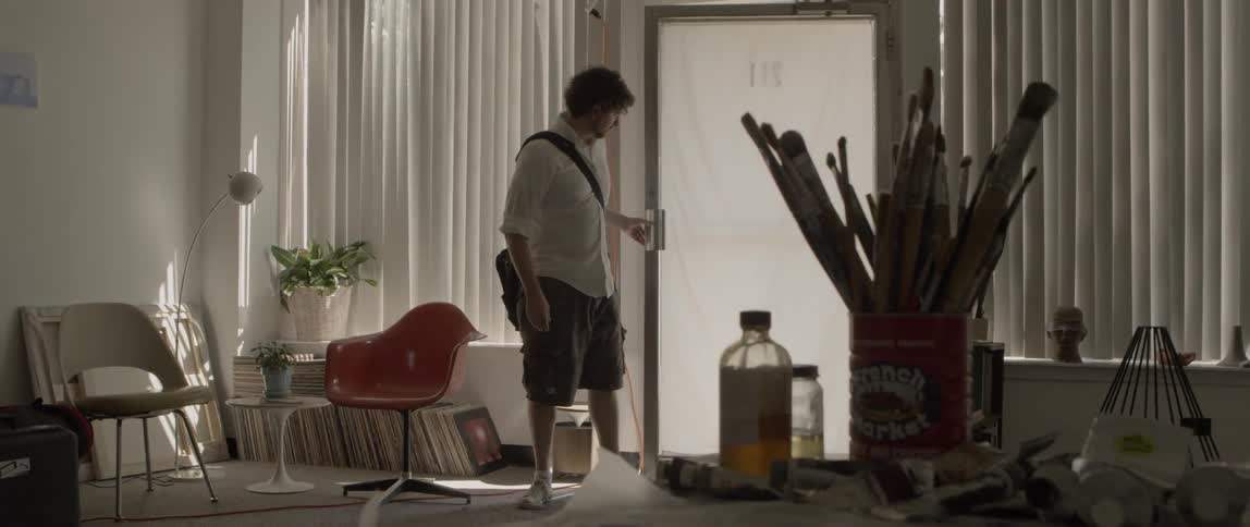 Man entering an art studio