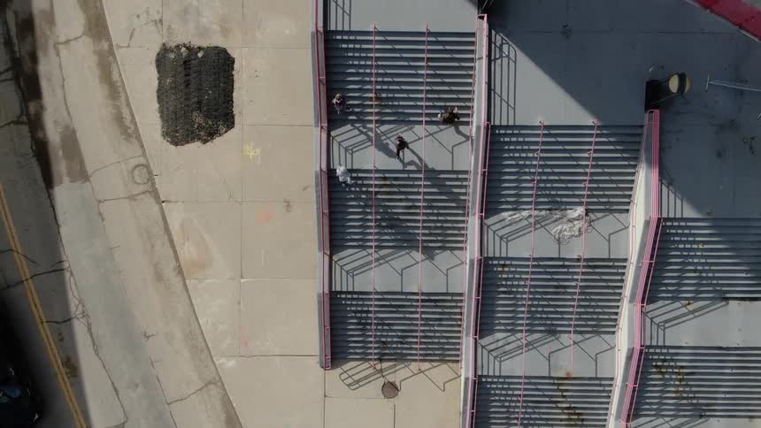 Runners running up stairs on a bleacher