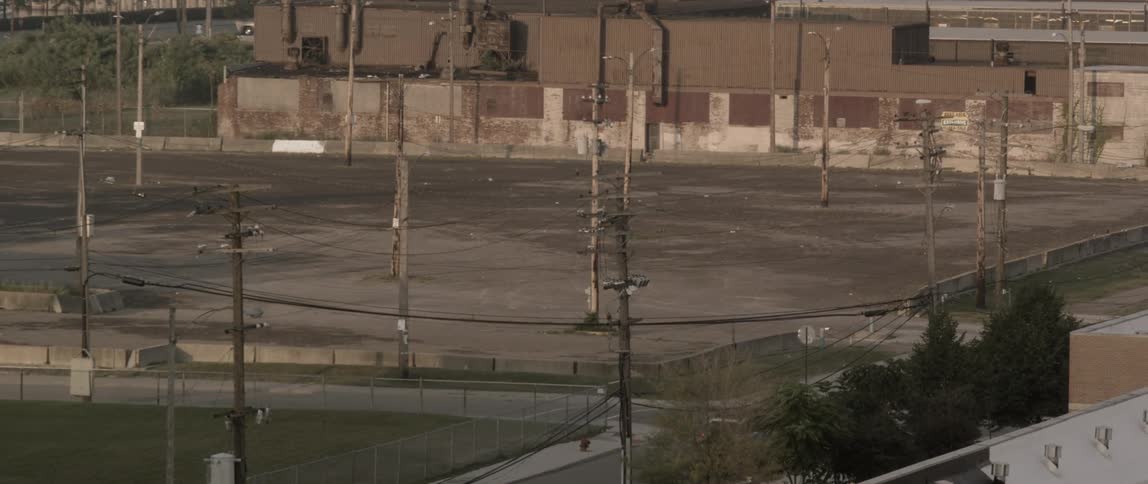 An empty parking lot in an urban area
