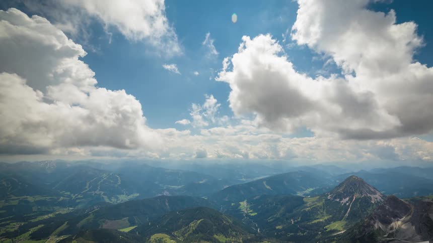 Clouds float high above a mountain range