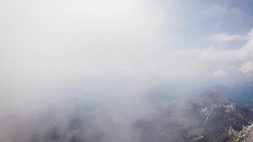 Clouds float over mountains in the wilderness
