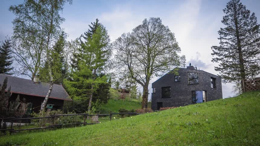 Clouds move quickly over a rural homestead