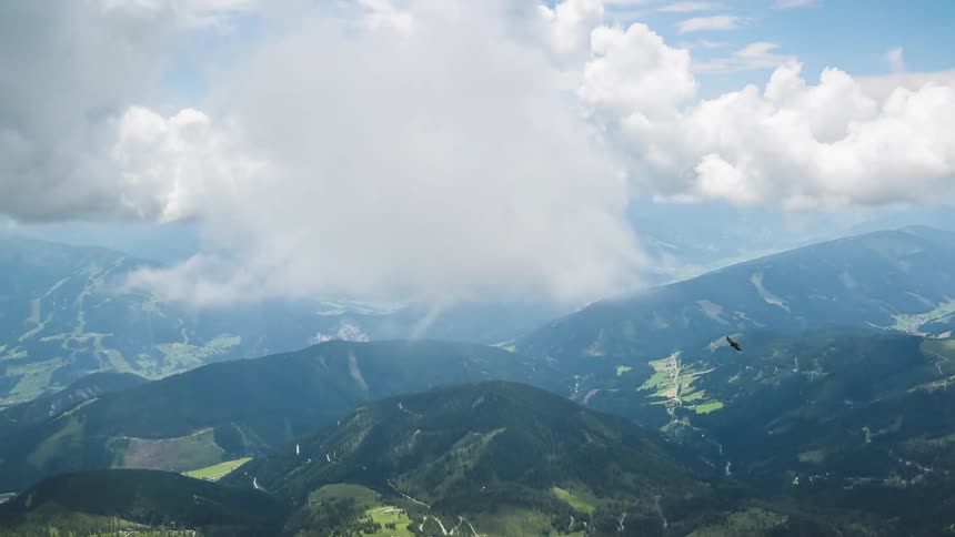 Clouds streaming over a mountain range