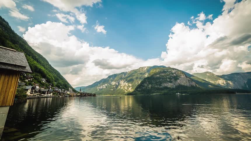 A lake sits in front of a mountain range